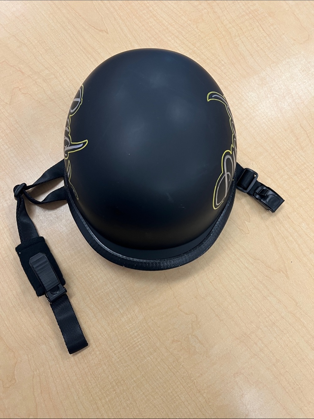 Matte Black Skate Helmet with Subtle Graphic